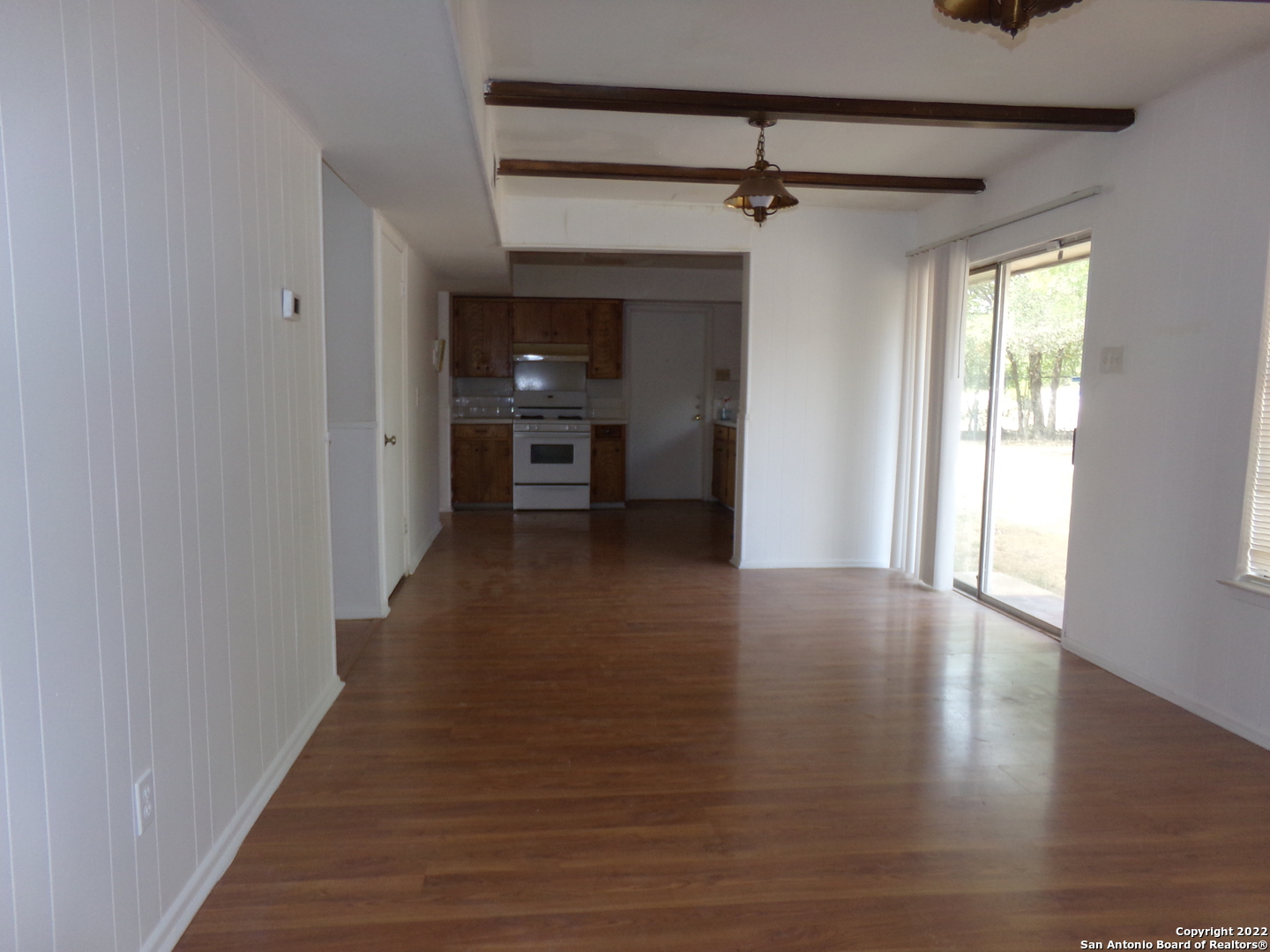 5975 Babcock Road San Antonio, TX 78240 - Photo 15 of 29 a view of a hallway with wooden floor and a cabinet