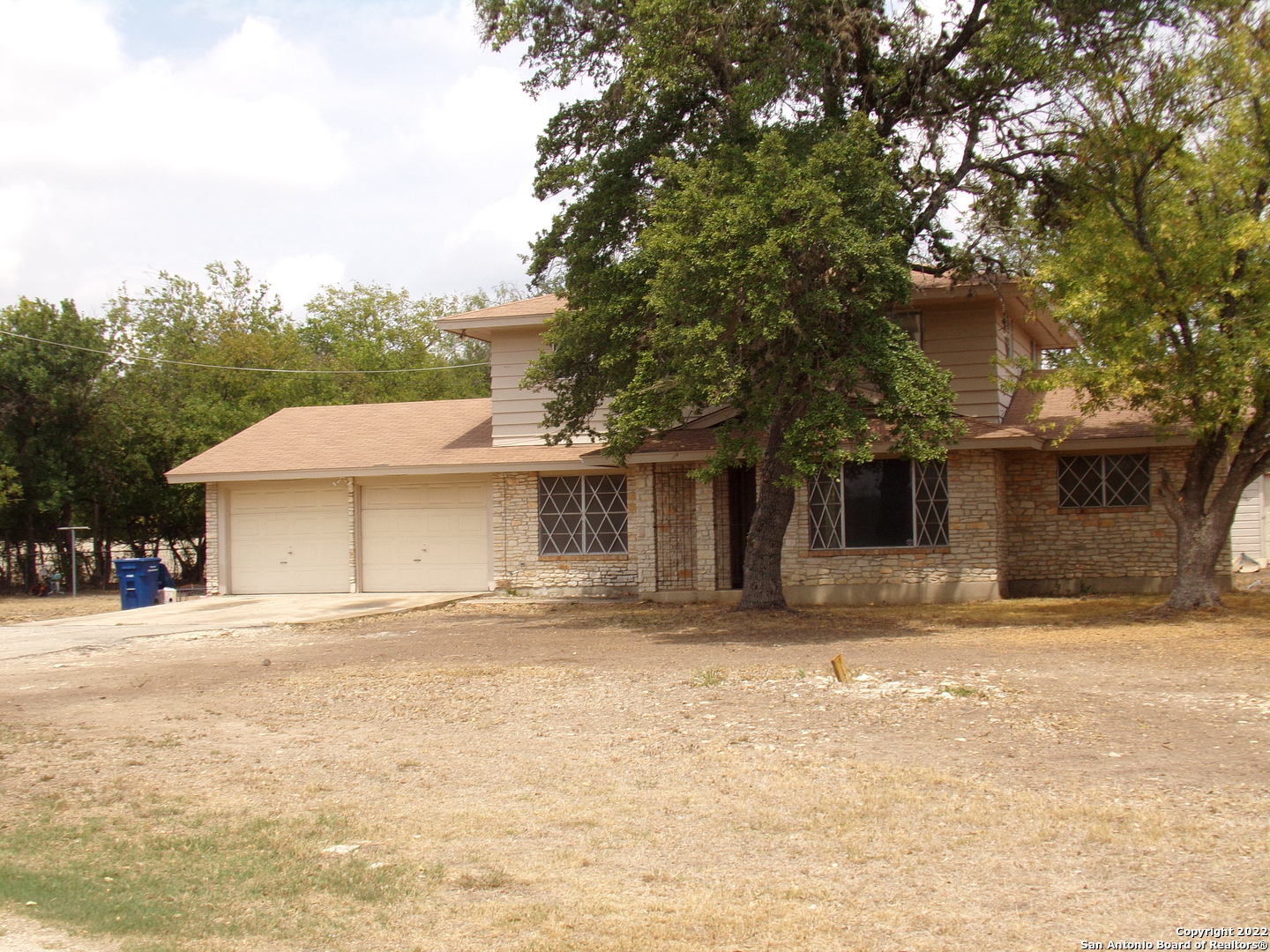 5975 Babcock Road San Antonio, TX 78240 - Photo 2 of 29 a house with trees in the background