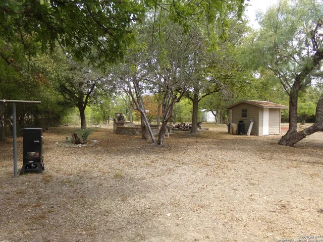 a view of outdoor space with deck and tree