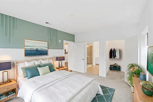 a bedroom with a bed and a lamp