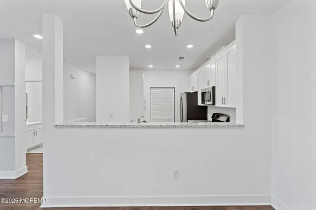 a view of a kitchen with a sink and dishwasher kitchen appliances