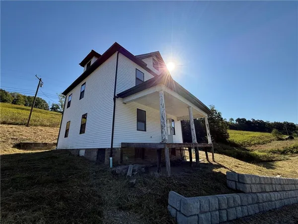 a house view with a backyard space