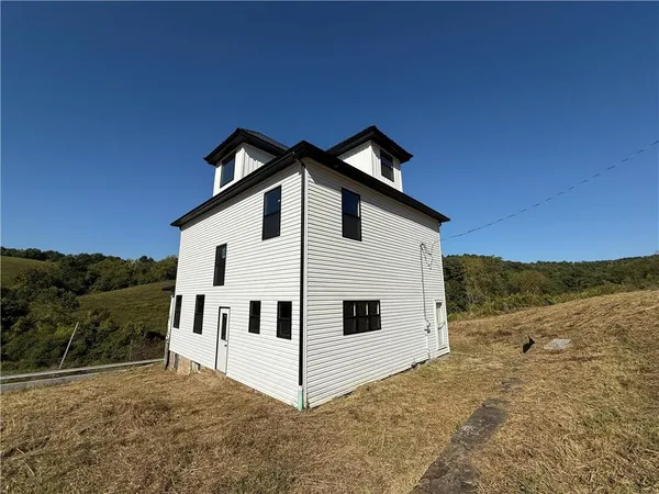 a front view of a house with a garage