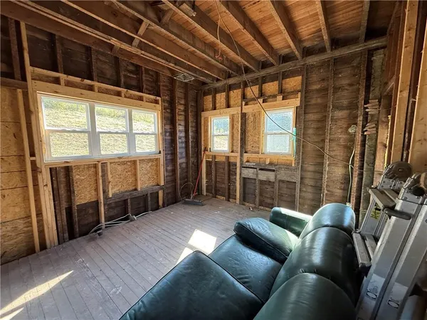 a view of an empty room with a fireplace