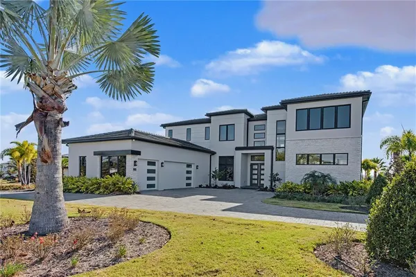 a front view of house with yard and swimming pool