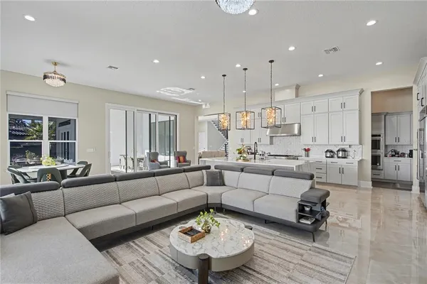 a living room with furniture and a large window