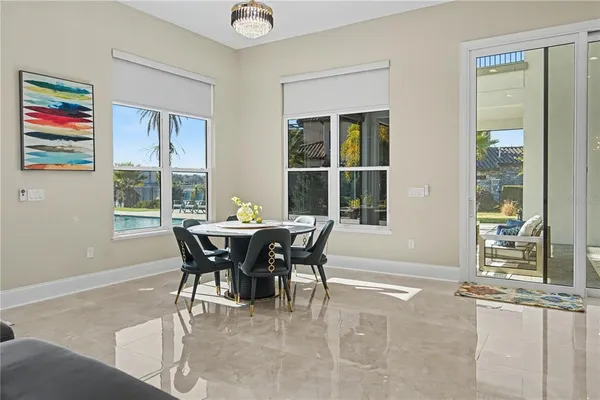 a dining room with furniture and window