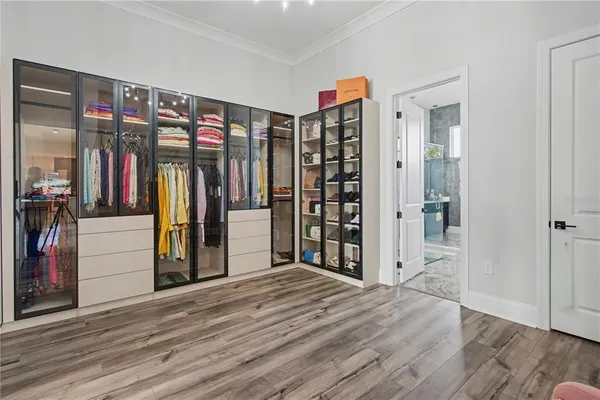 a bathroom with a shower sink and mirror