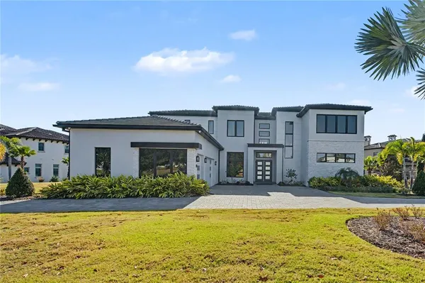 a front view of house with small swimming pool
