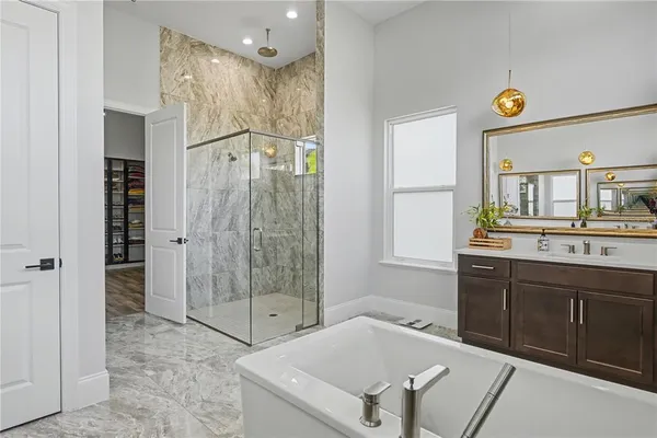 a bathroom with a sink a toilet and bathtub