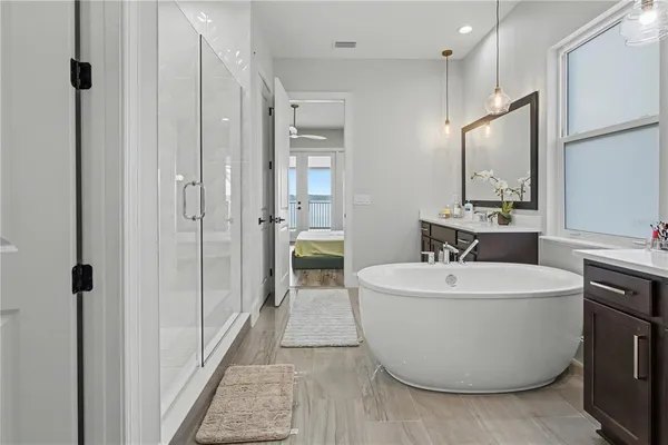 a bedroom with a bed table and a window