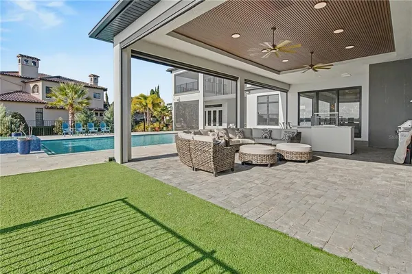 a view of a house with a yard and sitting area