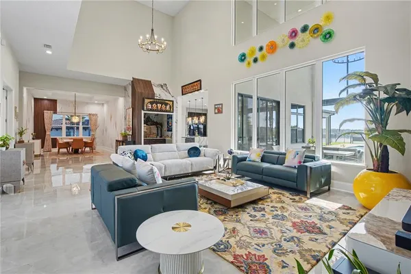 a living room with furniture and a potted plant