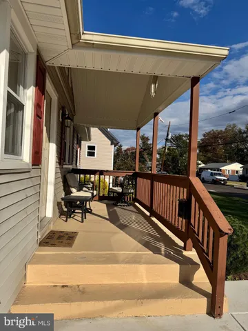 a view of balcony with furniture