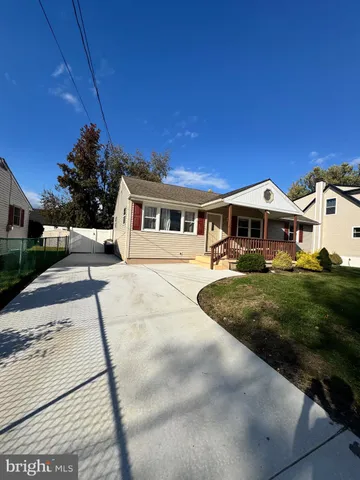 a view of multiple houses with a yard