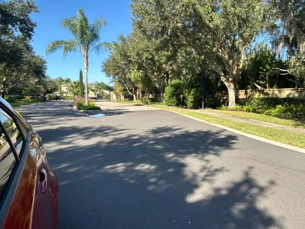 a view of a playground with basketball court