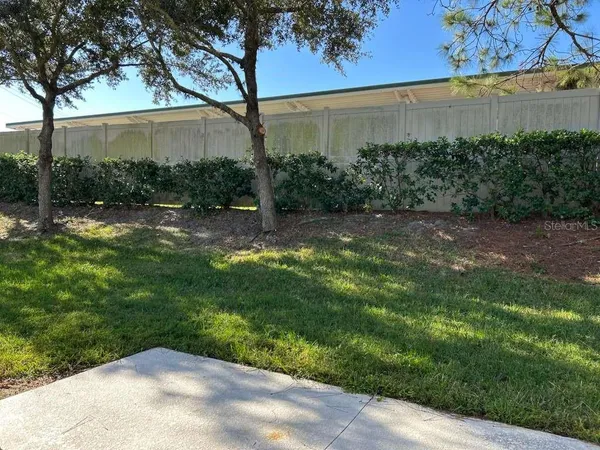 a backyard of a house with lots of green space