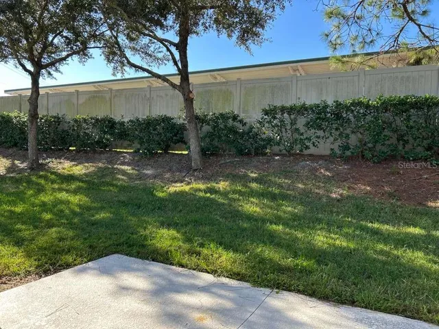a backyard of a house with lots of green space