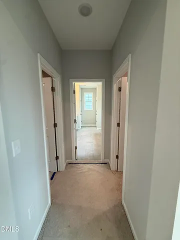 a spacious bathroom with a tub sink and mirror