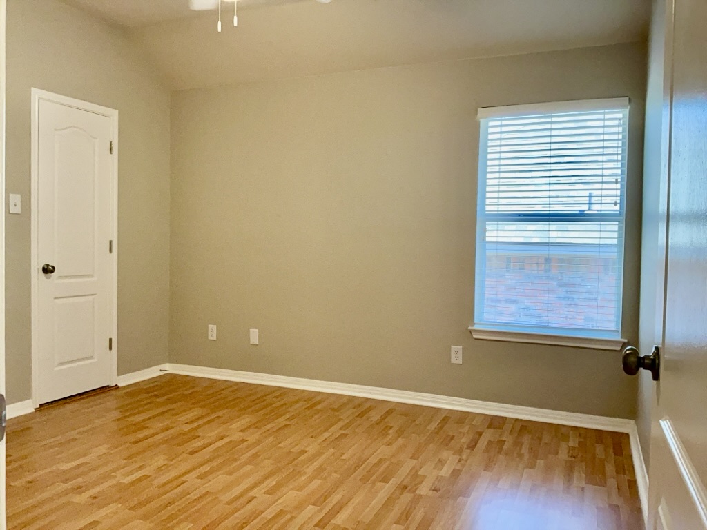 2518 Vestavia Ridge Lane Cedar Park, TX 78613 - Photo 12 of 23 Bedroom featuring light wood-style floors and vaulted ceiling