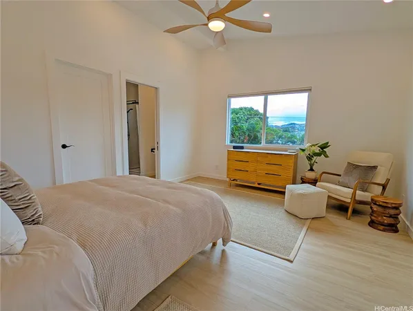 a bedroom with bed and window