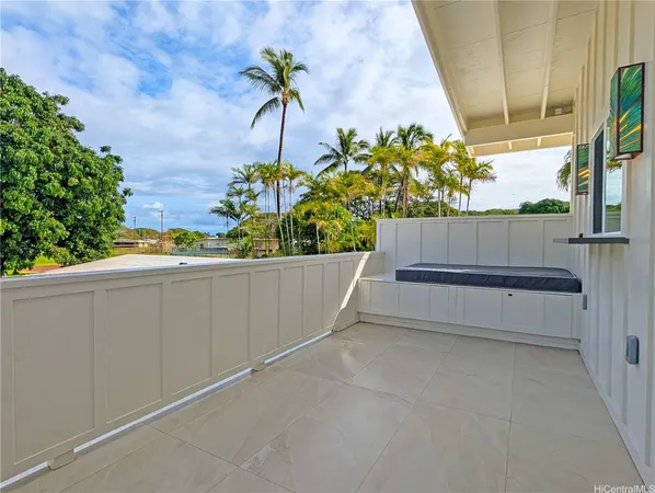 a view of a bench in a back yard of a building