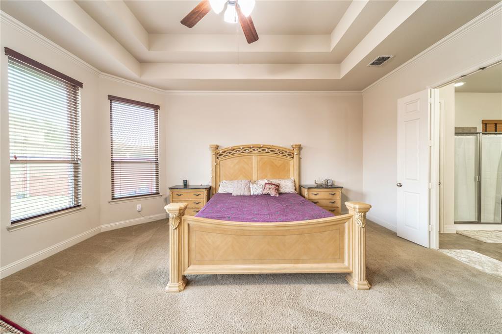 720 Nighthawk Drive Murphy, TX 75094 - Photo 18 of 40 a spacious bedroom with a bed and window