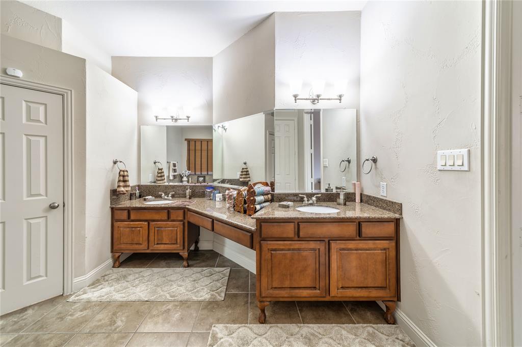 720 Nighthawk Drive Murphy, TX 75094 - Photo 20 of 40 a view of a kitchen with stainless steel appliances granite countertop a stove and cabinets