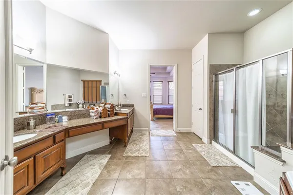 a large bathroom with a large tub and sink