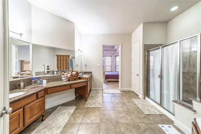 a large bathroom with a large tub and sink