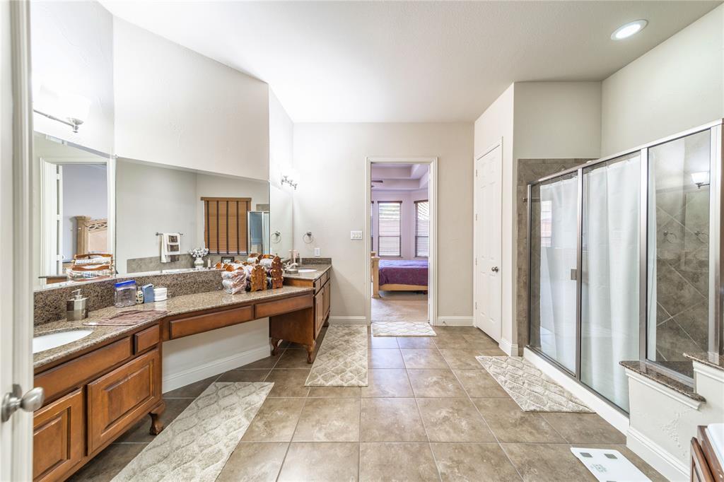 720 Nighthawk Drive Murphy, TX 75094 - Photo 21 of 40 a large bathroom with a large tub and sink