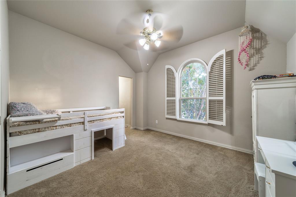720 Nighthawk Drive Murphy, TX 75094 - Photo 25 of 40 a view of a livingroom with a fireplace cabinet and window