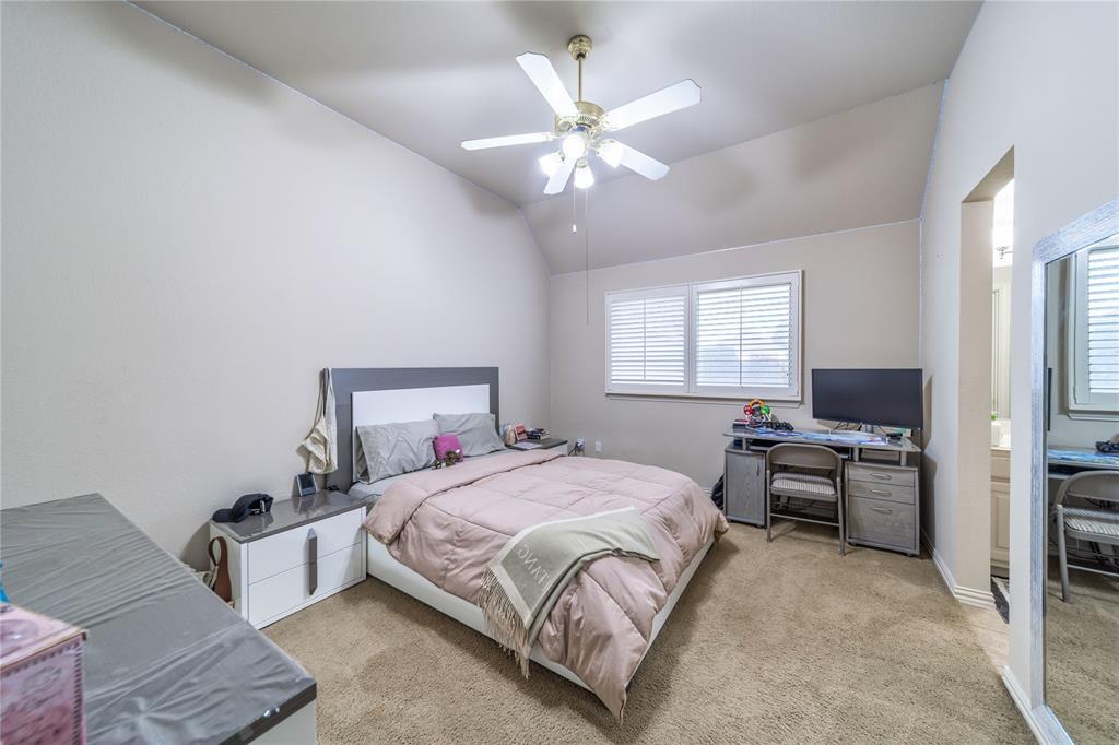 720 Nighthawk Drive Murphy, TX 75094 - Photo 31 of 40 a bedroom with a bed couch and window
