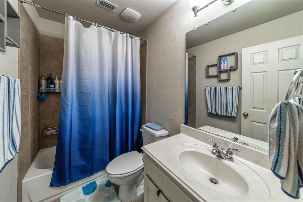 720 Nighthawk Drive Murphy, TX 75094 - Photo 34 of 40 a bathroom with a sink toilet and shower