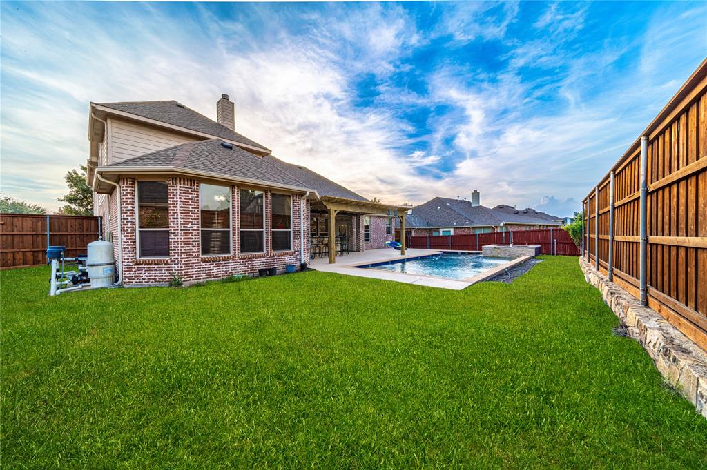720 Nighthawk Drive Murphy, TX 75094 - Photo 39 of 40 a view of a house with backyard and porch