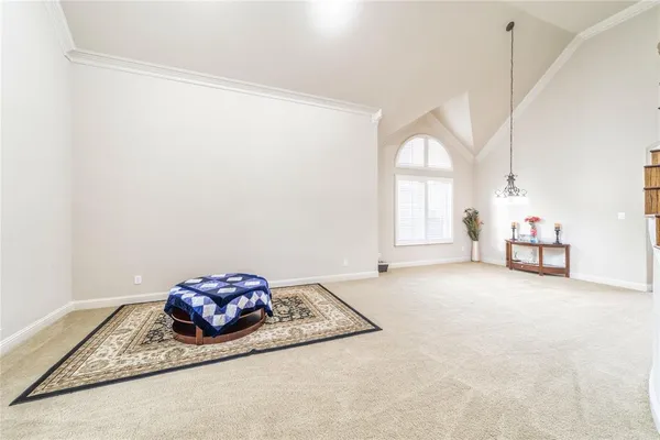 a view of a big room with closet and windows