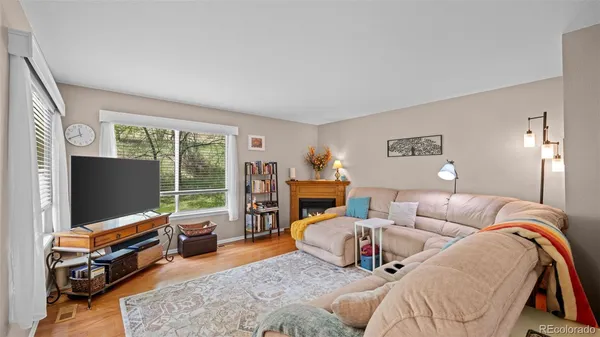 a bedroom with furniture and a flat screen tv