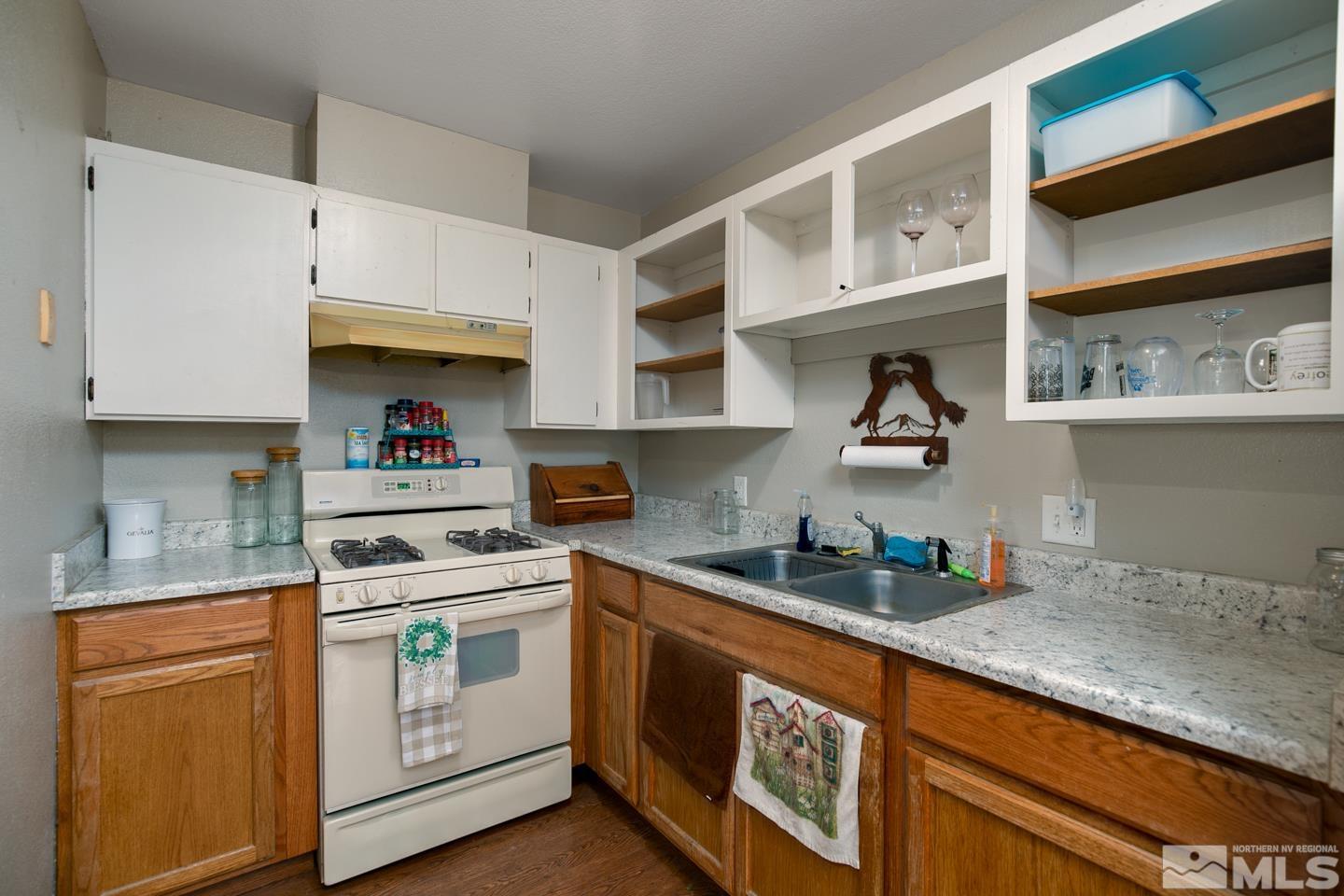 1080 Lee Fallon, NV 89406 - Photo 9 of 23 a kitchen with stainless steel appliances granite countertop a sink and cabinets
