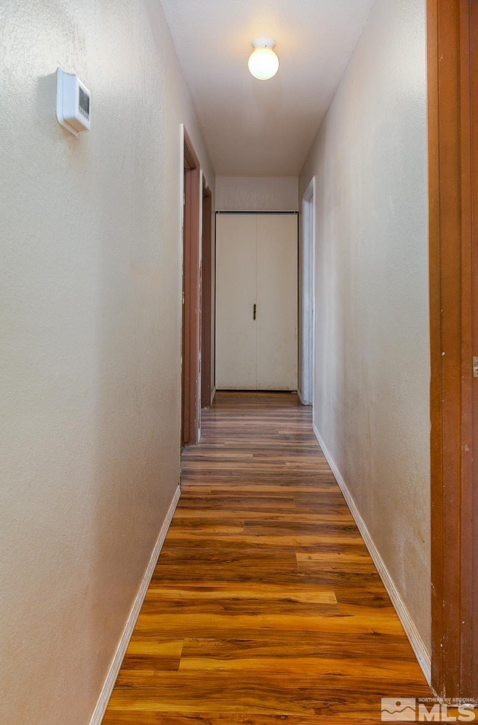 1080 Lee Fallon, NV 89406 - Photo 10 of 23 a view of a hallway with wooden floor and staircase