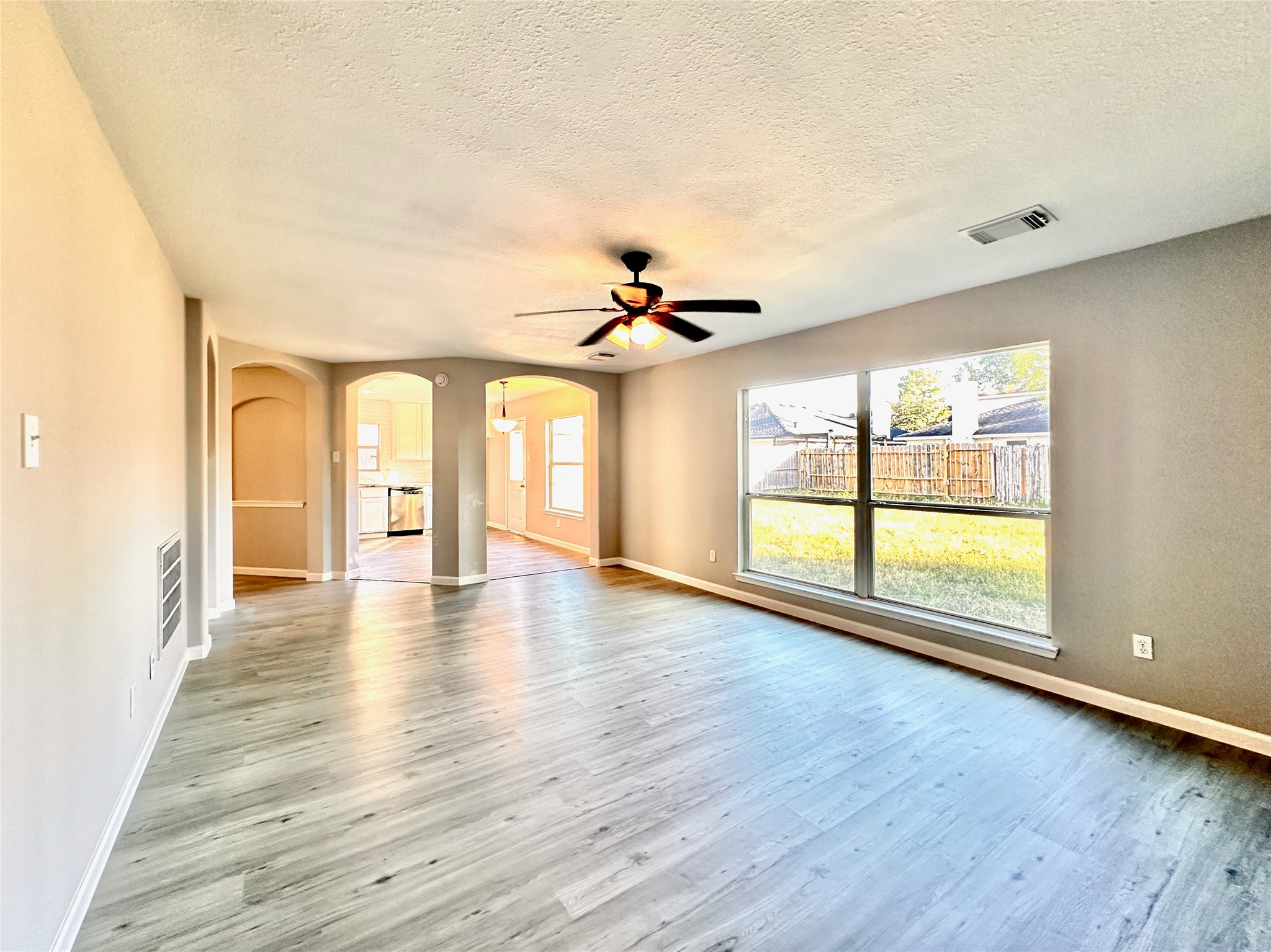 3042 Trinity Pass Court Spring, TX 77373 - Photo 11 of 34 wooden floor in an empty room with a window