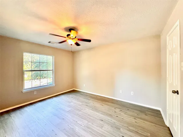 a spacious bathroom with a double vanity sink and a mirror