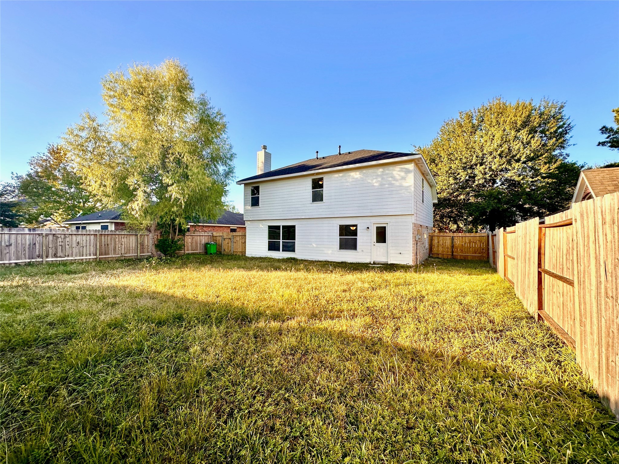 3042 Trinity Pass Court Spring, TX 77373 - Photo 33 of 34 a view of a white house with a yard