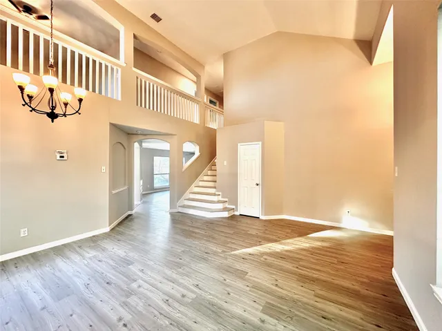 a view of an entryway with wooden floor