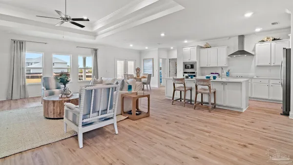 a view of kitchen with cabinets table and chairs