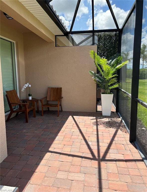 2084 Wellington Street Naples, FL 34120 - Photo 12 of 23 a vase of flowers sitting on a table