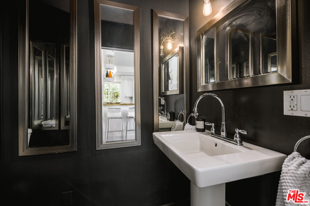 2225 North Cahuenga Boulevard Los Angeles, CA 90068 - Photo 15 of 30 a bathroom with a sink and a mirror
