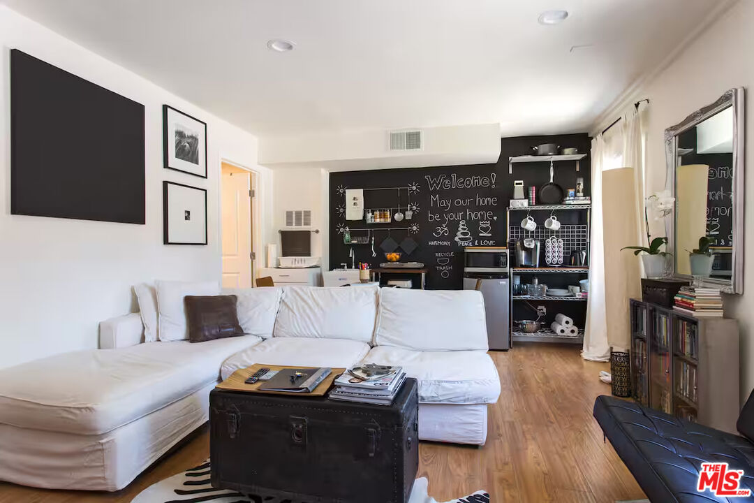 2225 North Cahuenga Boulevard Los Angeles, CA 90068 - Photo 22 of 30 a living room with furniture and a wooden floor