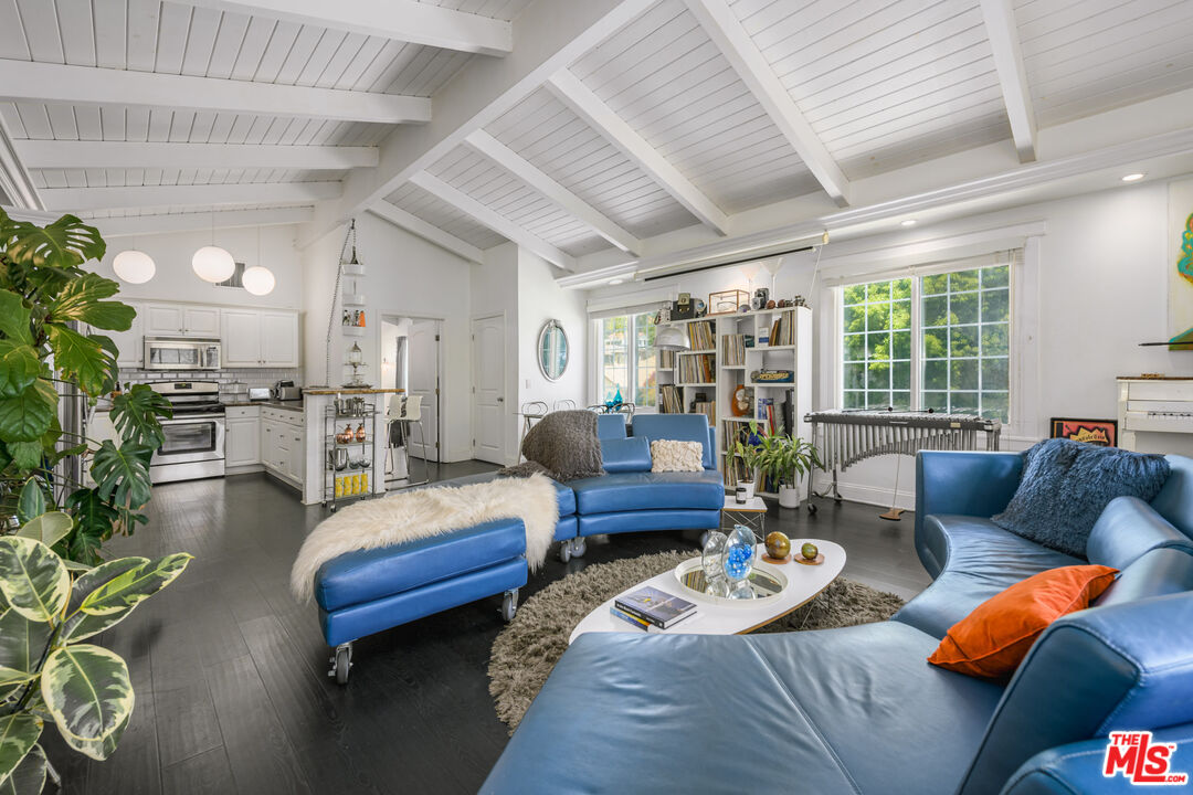 2225 North Cahuenga Boulevard Los Angeles, CA 90068 - Photo 4 of 30 a living room with furniture and a large window