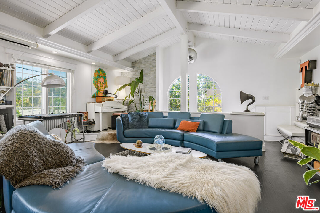 2225 North Cahuenga Boulevard Los Angeles, CA 90068 - Photo 5 of 30 a living room with furniture and a large window