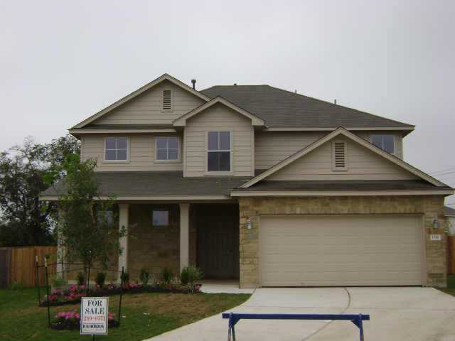1916 Ralph Cox Road Austin, TX 78748 - Photo 1 of 1 a front view of a house with a yard
